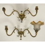 A pair of Art Nouveau period brass twin branch wall sconces