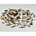 A large collection of yellow metal, gilt metal, white metal, steel, and brass pocket watch keys