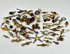 A large collection of yellow metal, gilt metal, white metal, steel, and brass pocket watch keys