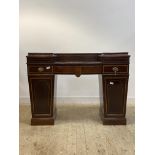 An Edwardian Sheraton revival mahogany twin pedestal sideboard, inlaid with satinwood cross bands