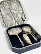 A Sheffield silver three piece engine turned decorated dressing table set engraved with initial M,