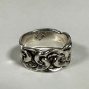 A silver cast ring with scrolling interlocking panel to front (h: 0.5cm x 2cm) (Q/R) stamped 925