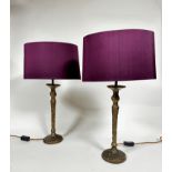 A pair of Heathfield & Co Olivia bronze cast finish Giacometti style candlestick table lamps,