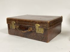 A 1930's snakeskin overnight case, with leather carry handle and silk lined interior H17cm, W46cm,