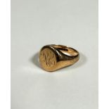 A 9ct gold gentleman's style signet ring with engraved initials RC, (T) (8.68g)