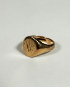 A 9ct gold gentleman's style signet ring with engraved initials RC, (T) (8.68g)