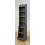 An early 20th century grey painted waterfall bookcase, H153cm, W34cm, D27cm