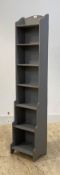 An early 20th century grey painted waterfall bookcase, H153cm, W34cm, D27cm