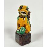 A late 19th early 20thc Chinese Buddhist dog of Foo pastel burner, the seated figure raised on