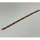 A three coloured 9ct gold bracelet (L: 18.5cm) (10g) shows no signs of damage, restoration or