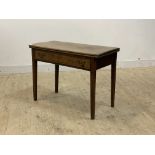 A George III mahogany fold over tea table, late 18th century, the fold over top supported by a swing