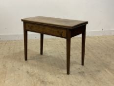 A George III mahogany fold over tea table, late 18th century, the fold over top supported by a swing