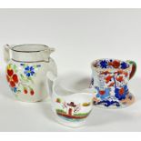 A cream ware pottery 19thc jug decorated with naive style floral sprays, chips to rim and spout,