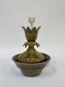 A studio pottery lotus shaped table fountain, decorated with amber to green glaze with a