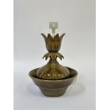 A studio pottery lotus shaped table fountain, decorated with amber to green glaze with a