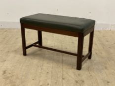 An early 20th century mahogany duet stool or window seat, the top upholstered in green faux leather,