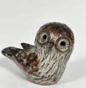 J K, pottery moulded figure of a seated owl with inset hollowed eyes, (h: 15cm x 17cm)