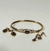 A 9ct gold stiff hinged bangle set oval amethyst in open work setting, (6.5cm x 5cm) and two pairs