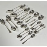 A set of four Mappin & Webb Sheffield 1946 silver Onslow style pattern table spoons, a set of six