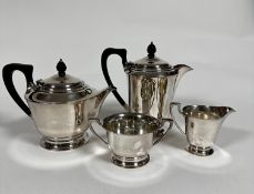 An Epns four piece tea and coffee service with ebonised handles and acorn style knop, of tapered