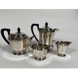 An Epns four piece tea and coffee service with ebonised handles and acorn style knop, of tapered