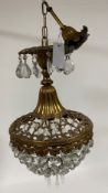 A 20th century French style anthemion and floral cast gilt brass and glass cage chandelier, the