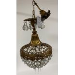 A 20th century French style anthemion and floral cast gilt brass and glass cage chandelier, the