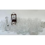 A large collection of crystal comprising a full tantalus/decanter, a large bowl, jug, a Royal