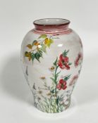 A large Italian pottery baluster vase decorated with handpainted flowers including La Vanda,