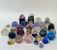 A large collection of studio/art glass paperweights comprising several Scottish/Caithness examples