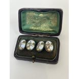 Angling interest: a pair of silver oval sleeve links with enamelled panels depicting a fisherman