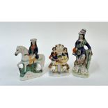 A group of three 19thc Staffordshire, including Highland Shepherd with two lambs at feet (h- 28cm