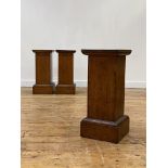 A set of three late 19th/ early 20th century oak plinths of rectangular outline, each with a