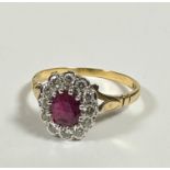 An 18ct gold ruby and diamond cluster earring mounted in white gold setting, stone approximately 0.
