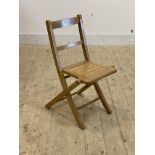 A small vintage beech folding childs chair, H65cm