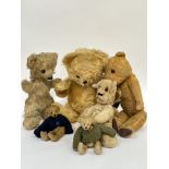 A pair of miniature sand filled golden mohair vintage teddy bears with inset glass bead eyes,