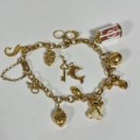 An Italian oval link charm style bracelet with a collection of miscellaneous charms including a