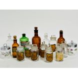 A group of fourteen various chemist tincture and powder pharmacy bottles including three brown