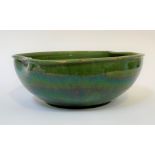 A hand-thrown green glazed earthenware bowl/basin, H15cm, W39.5cm.