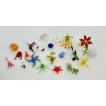 A group of various miniature glass figures such as a lobster, a pink shrimp, an orange shrimp, a