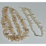 A two strand baroque pearl necklace, slight pink to cream, with 9ct gold clasp fastening, (L: