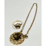 A 1960s / 70s 9ct gold open work pendant with circular Cairngorm faceted stone, mounted in four claw