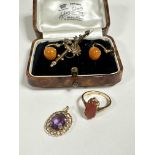 A 9ct gold navette shaped carnelian dress ring mounted in claw setting, (J) a pair of carnelian stud