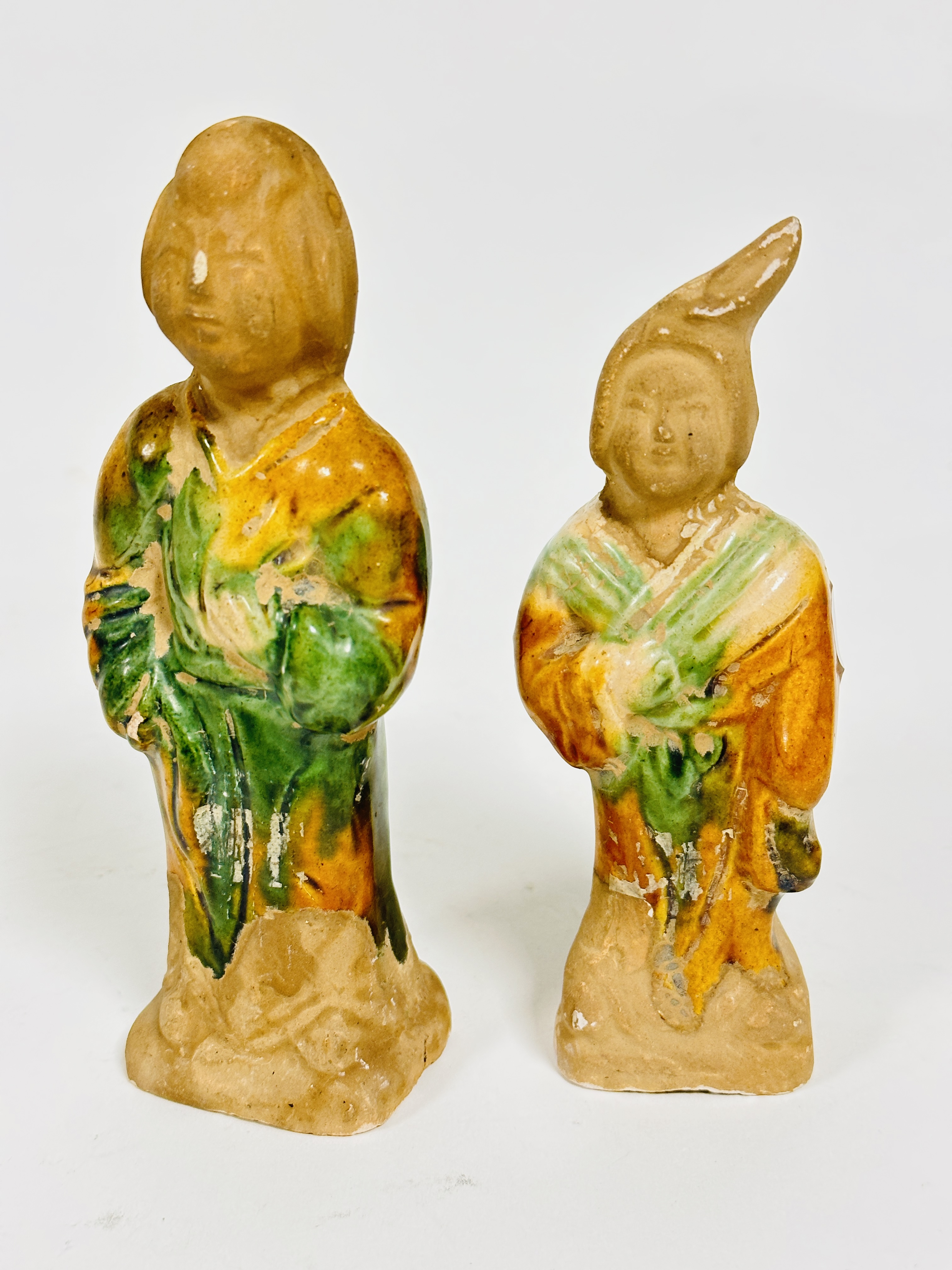 A pair of modern Chinese pottery honey and green glazed tomb figures, (h: 15cm x 14cm, base 5cm x