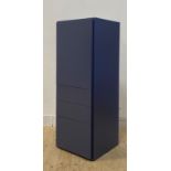 A quality contemporary blue laminate cabinet, the cupboard enclosing two shelves, over three