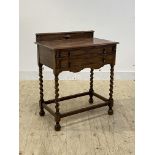 A 1930's oak table canteen of 18th century design, two drawers with fitted interiors containing a