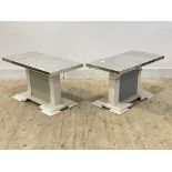 A pair of low tables, each with sectional mirrored glass tops raised on white and grey painted