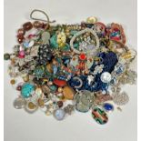 A large collection of bead necklaces, white metal brooches, silver hardstone mounted pendants