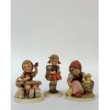 A group of three Hummel figures comprising "Chick Girl", "Farewell" and a girl wearing a backpack