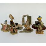 A group of various animal models comprising The World of Beatrix Potter three rabbits by a